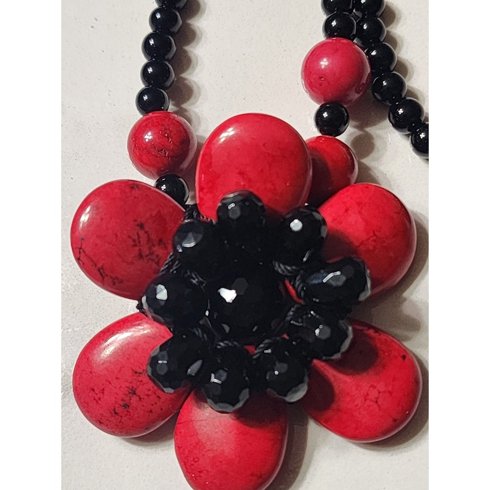 Long sterling silver clasp and dyed coral flower necklace  by AIL Statement